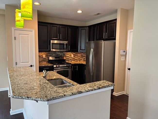 Building Photo - Beautiful End Unit Townhome in the McCarle...