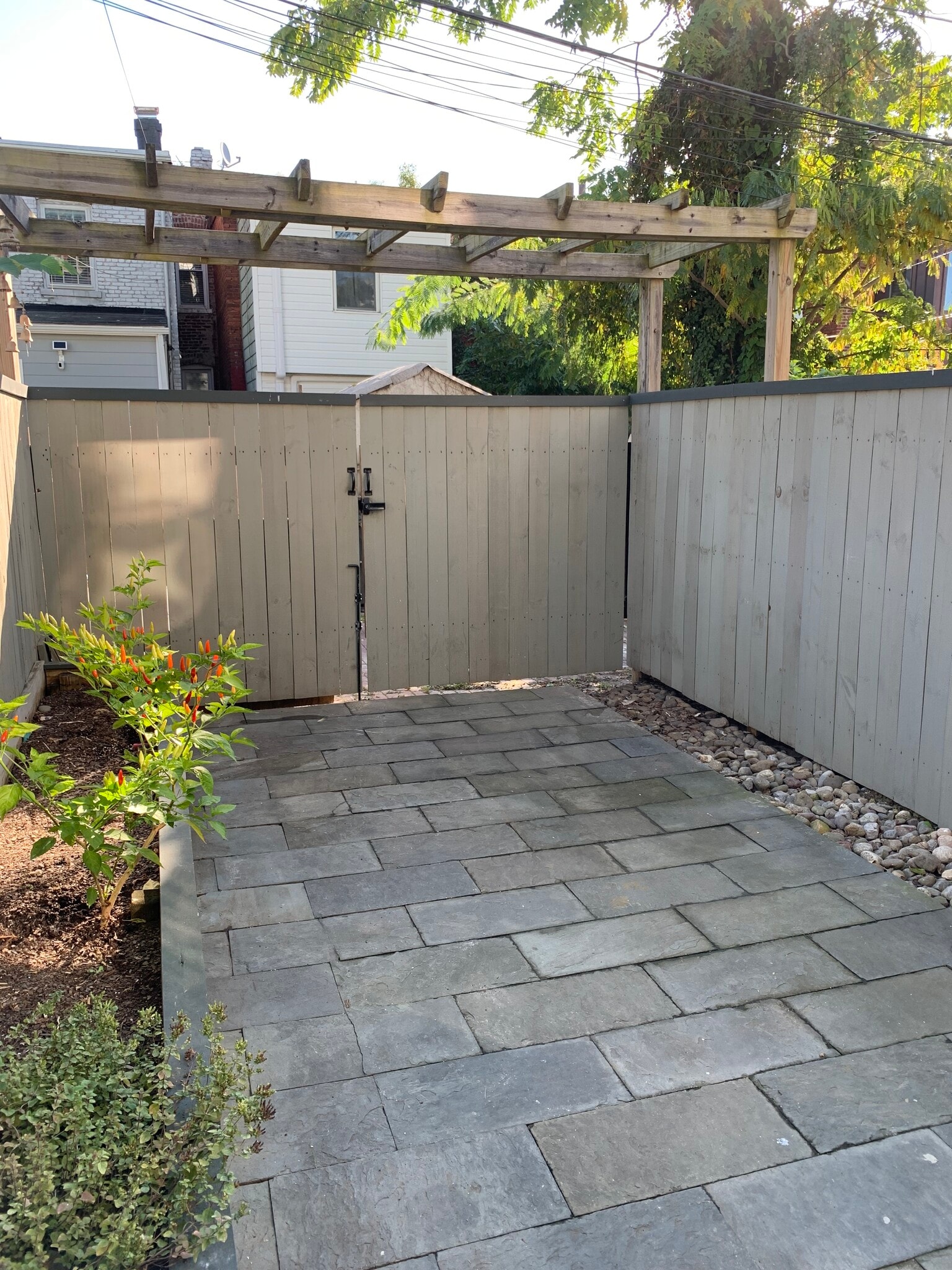 Private back patio and raised garden bed. - 2241 12th Plz NW