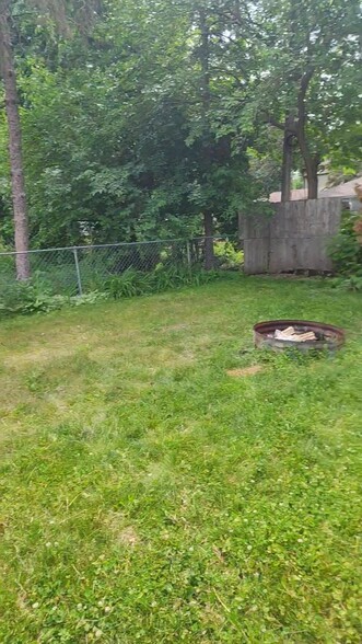 Shared fire pit in backyard - 4449 Unity Ave N