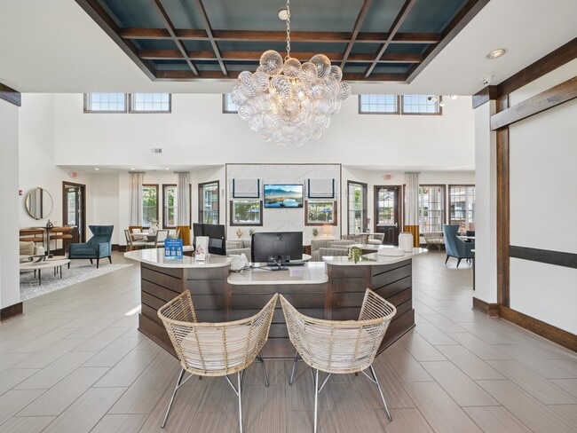 Modern resident clubhouse and leasing lounge at Village at Broadstone Station apartments in Apex, NC - Village at Broadstone Station