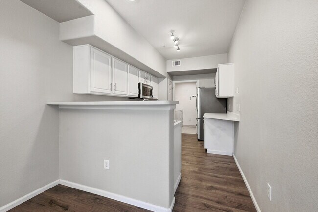 Building Photo - $1,745.95 - Ground-Level 1 Bed + Flex Room | 1.5 Bath Condo with Community Pool