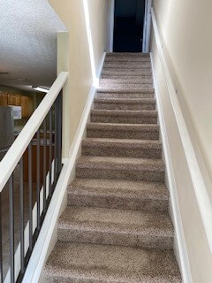 Stairs to main level - 4763 Travini Cir