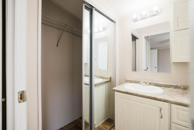 Primary closet w/ sliding mirror doors in Primary Bathroom. - 1225 Orizaba