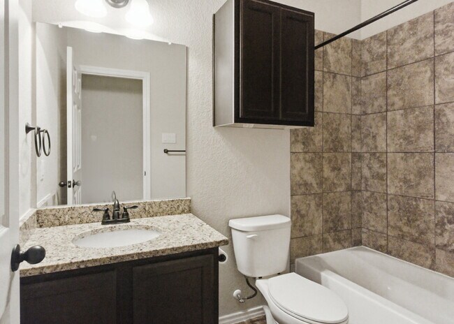 Building Photo - 3 Bedroom Duplex with Stained Concrete Floors and Greenbelt Views!