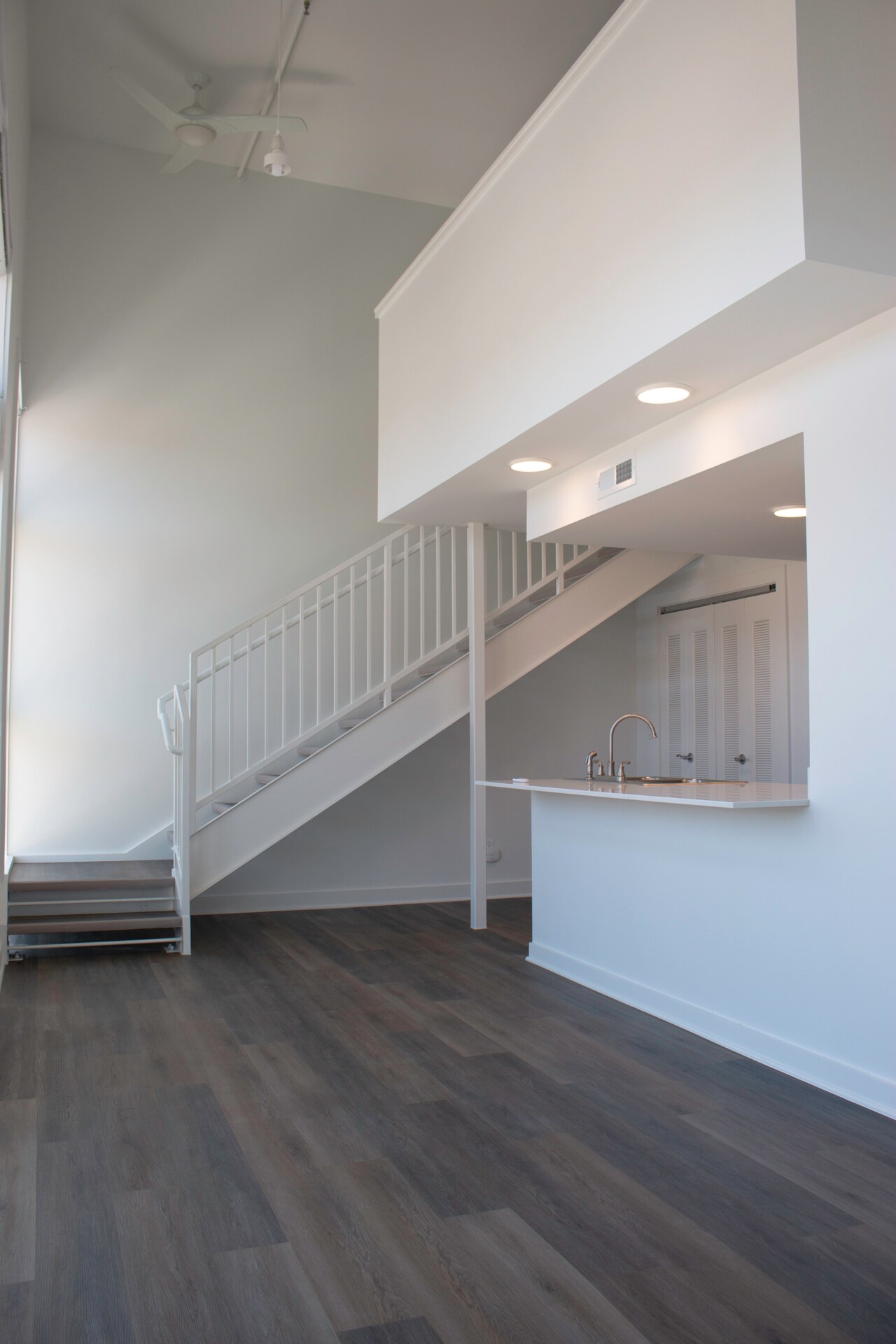 Open living area and stairs to loft - 318 E 6th St