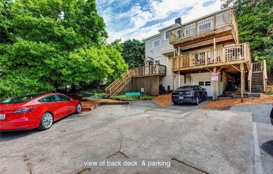 back view, deck is top one, designated private parking area - 631 N Garden St