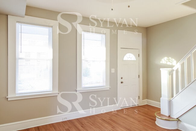 Building Photo - Welcome to this charming abode.