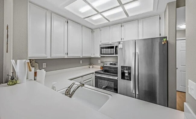 Building Photo - This spacious Norris Canyon condo will del...