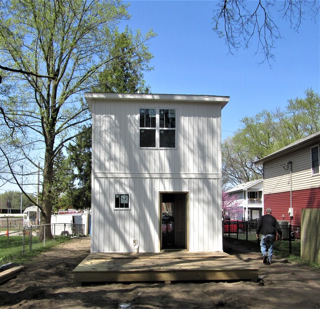 rear with deck - yard still not in - 409 W Maple St