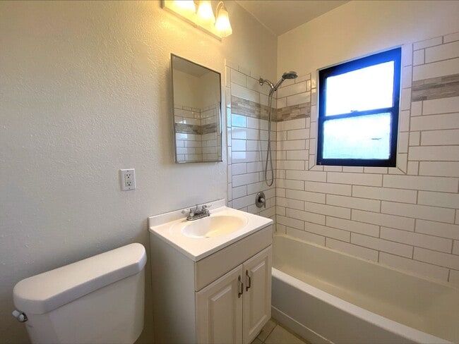 Building Photo - Craftsman Style One Bedroom with Decorative Fireplace! On Site Washer and Dryer & Assigned Storag...