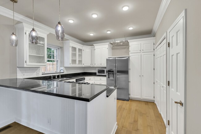 Wonderful kitchen with stainless steel appliances, white subway tile backsplash and granite counters - 153B Woodmont Blvd