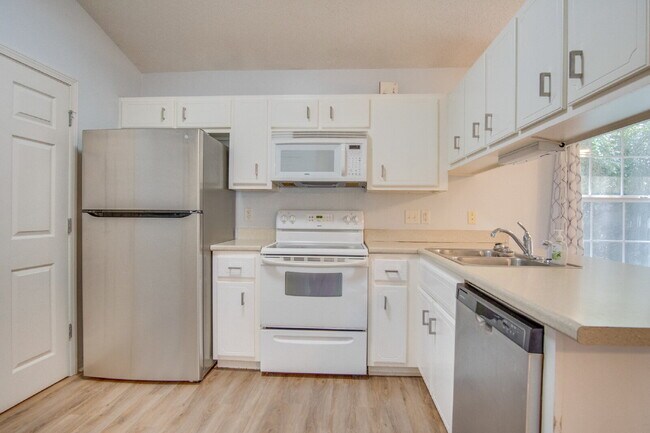 Building Photo - Northeast Pensacola 2 R, 2BA Home Near UWF with Wood-Look Flooring, Large Sunroom, Spacious Lot &...