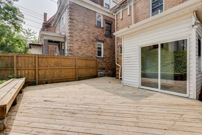 Building Photo - AVAILABLE June 2026 - Beautiful 4 Bedroom, 2 Bath Home w/ Front Porch Swing!