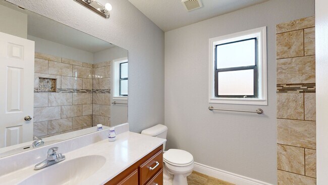 Building Photo - Completely repainted 4 bedroom ALL TILE ho...