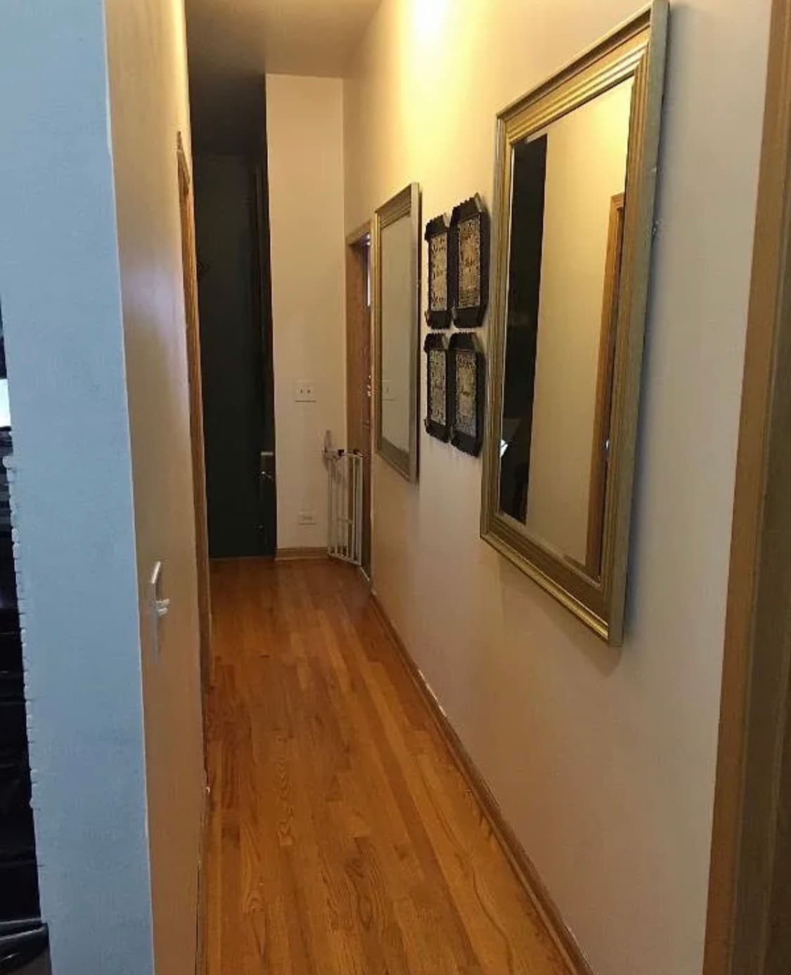 Hallway leading to bedrooms, bathrooms and basement. - 419 W Root St