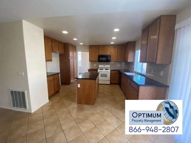 Building Photo - Spacious 4-Bedroom Home with 3-Car Garage & Downstairs Suite!