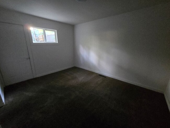 Building Photo - 3 bed 1 bath W/ back yard bunker!