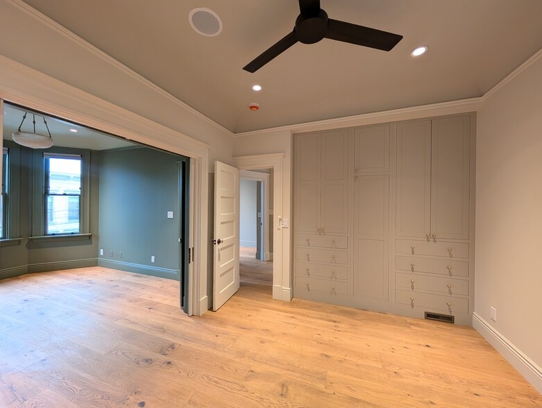 Functional pocket doors enable you to separate or combine the front parlor + main bedroom at will. - 328 Lexington St