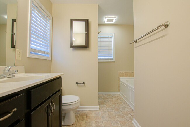 Building Photo - Pet Friendly Three Bedroom with Bonus!