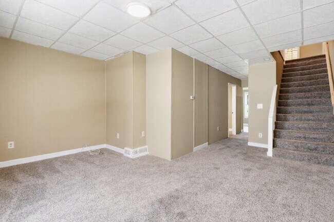 Building Photo - This well-maintained 4-bedroom, 2-bath duplex offers a spacious layout with all the comforts of h...