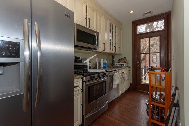 Building Photo - 9/1 Modern 4BR/2BA with AC, laundry in unit @ Brigham Circle!