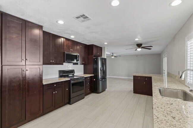 Building Photo - Welcome to your entertainers dream home with solar and pool service included!