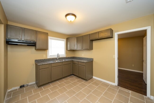 Building Photo - Move-In Ready Modern Makeover! Spacious 4-Bedroom Gem You’ll Love!