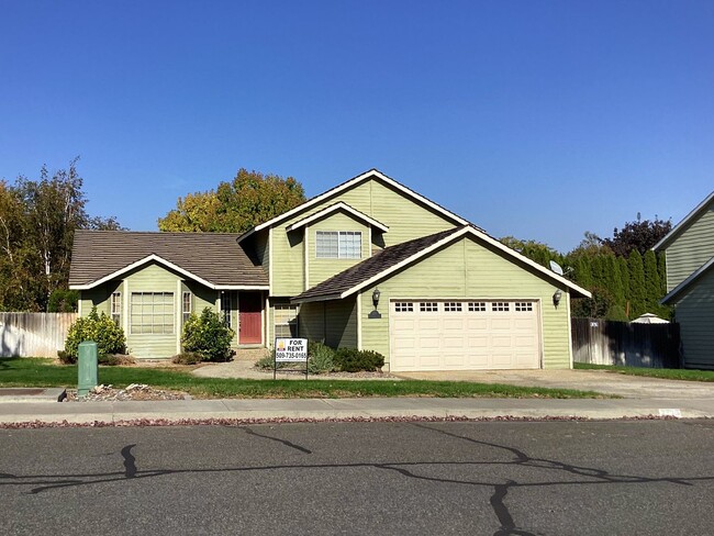 Primary Photo - Split-Level Home with Fireplace and Patio ...