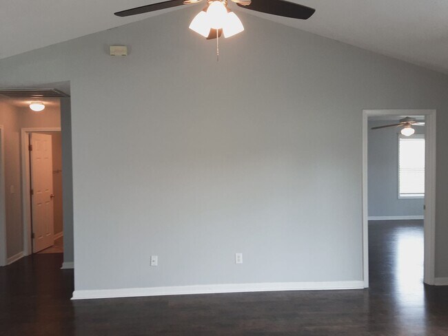 Building Photo - 1/2 off First Month Rent home has new flooring throughout.