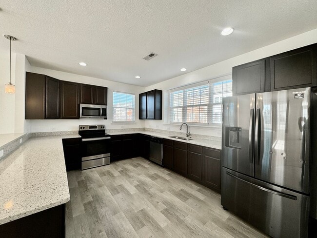 Building Photo - 3 Bedroom Townhome in Spence Crossing! Water/Sewer/Trash/Landscaping INCLUDED! - Attached Garage ...