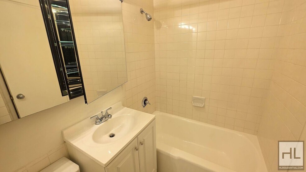 Building Photo - Bright Ninth-Floor Studio with Exceptional Closet Space near the UN
