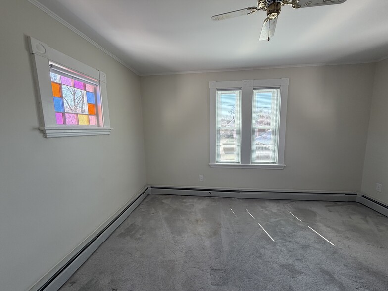 Bedroom has beautiful stained glass windows - 19 Irving St