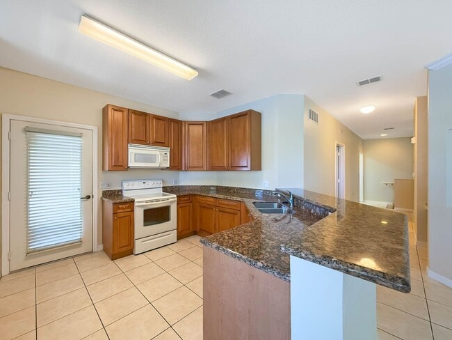 Building Photo - Beautiful 3-Bedroom Condo with 2-Car Garag...