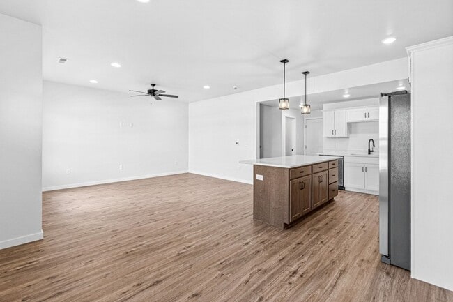 Building Photo - New 3 Bed Townhome with Covered Deck and Oversized Garage!