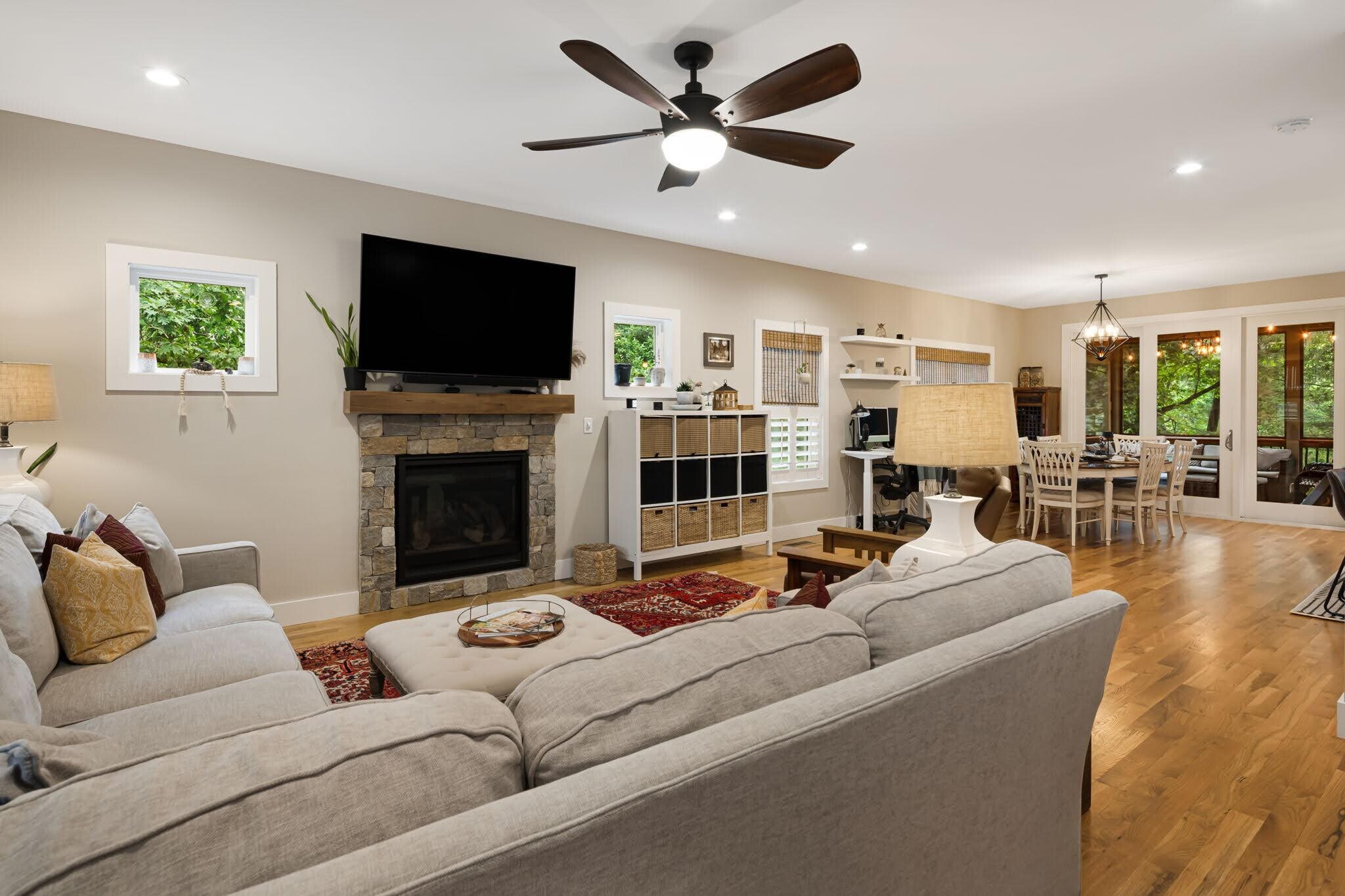 Open multi-purpose living space with gas fireplace and beautiful oak hardwood floors. - 33 Rex Dr