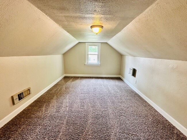 Building Photo - Updated two story home with unfinished bas...