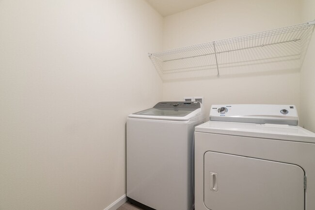 Building Photo - Super clean & spacious 4-bdrm/3-bath townhome in NE—Attached garage, great location