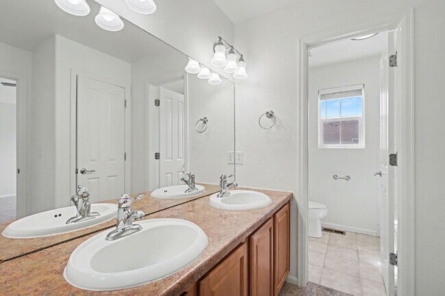 Building Photo - Beautifully Updated 3-Bedroom End-Unit Townhome Facing Open Space with Attached 2-Car Garage in G...