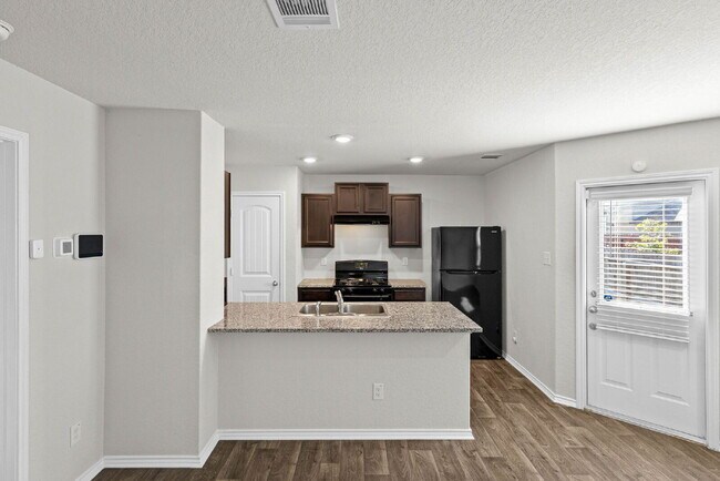 Building Photo - Welcome to Your Bright and Inviting Home