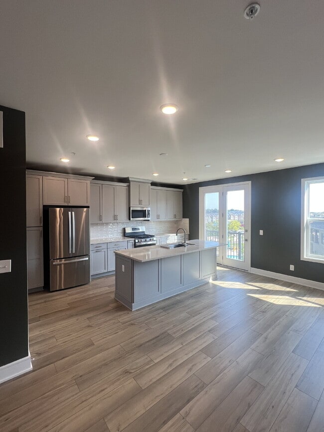 Building Photo - Brand-New Luxury 3BR Townhome-Style Condo ...
