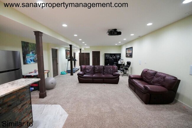 Building Photo - "Luxury Ranch Living: Your Dream Home with Furnished Basement in Urbandale"
