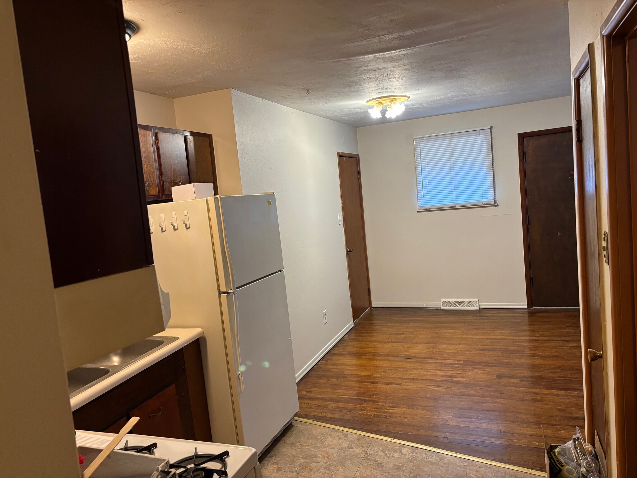 Kitchen into dining area - 2454 S Old Highway 141