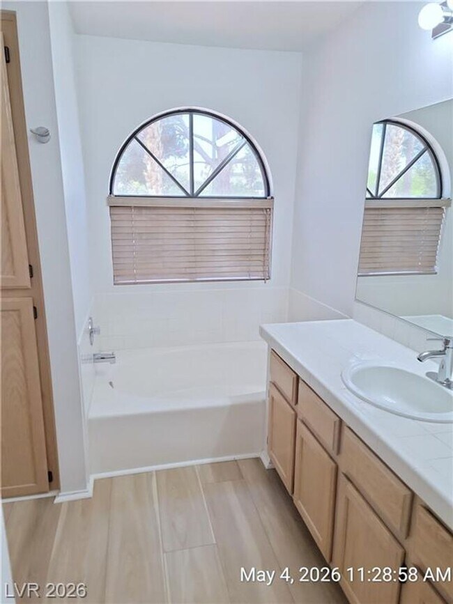 Building Photo - The Lakes Home with No Carpet, Fireplace & Covered Patio