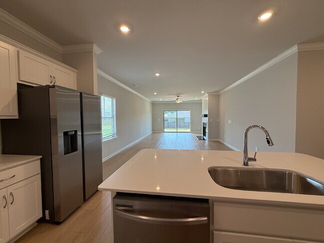 Building Photo - "NEWLY BUILT- Spacious 4-Bedroom Haven with Granite Elegance and Cozy Fireplace in Harvest"