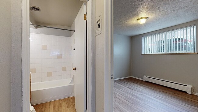 Experience the warmth of this bright and functional living space, perfect for modern comfort. - Harmony Apartments