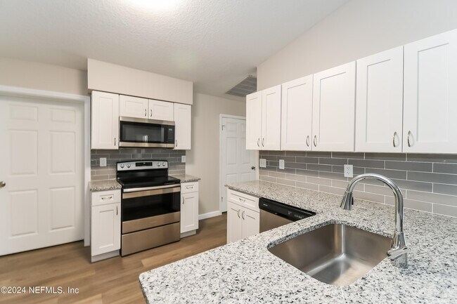 Building Photo - 7263 Eudine Dr N