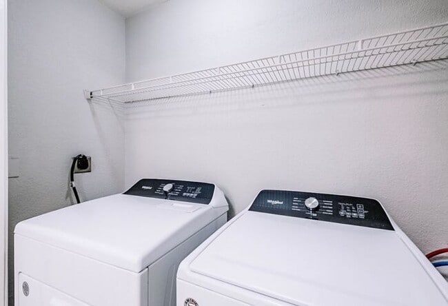 Building Photo - Spacious 2-Bedroom Elite Apartment with Private Balconies & Washer/Dryer