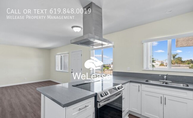 Building Photo - Welcome to this Beautifully Renovated top-...