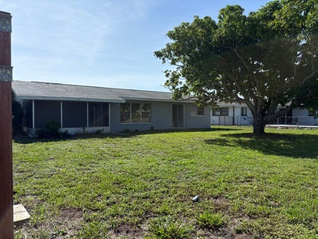 Building Photo - ****TWO WEEK FREE**** Charming 2-Bedroom Ranch in Cape Coral’s Bimini Basin Neighborhood