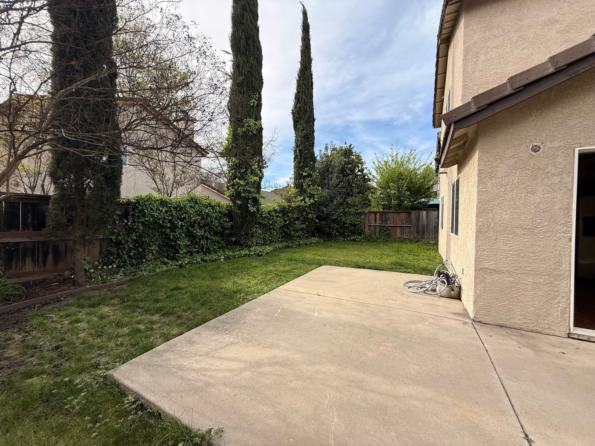 Backyard wrapping around rear side of home - 3326 Amberfield Cir